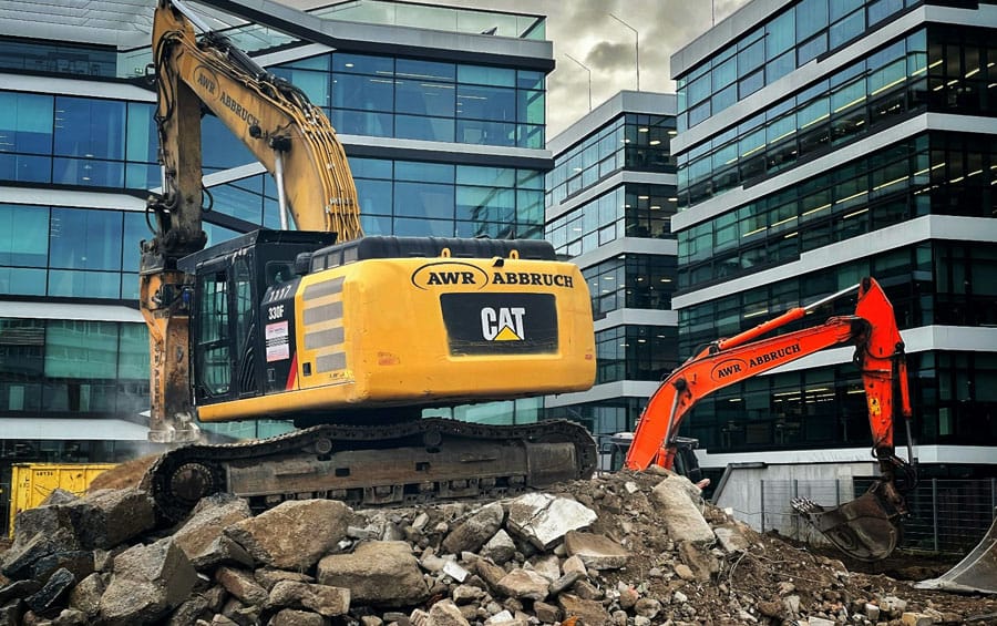 Demolition services in Austin TX with excavator and debris removal